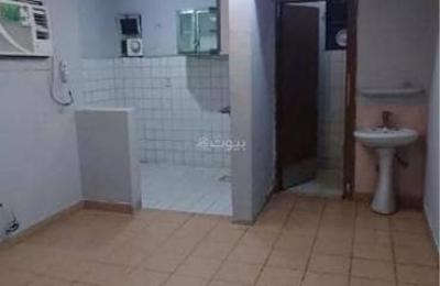 A room, living room, and kitchen for singles in Al-Izdihar neighborhood