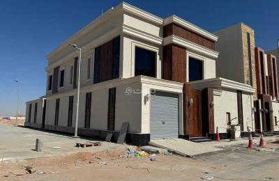 Villa for sale, corner in the Tanall Al-Rimal neighborhood, near King Khalid Airport, on a corner lot with two streets, internal stairs with a modern